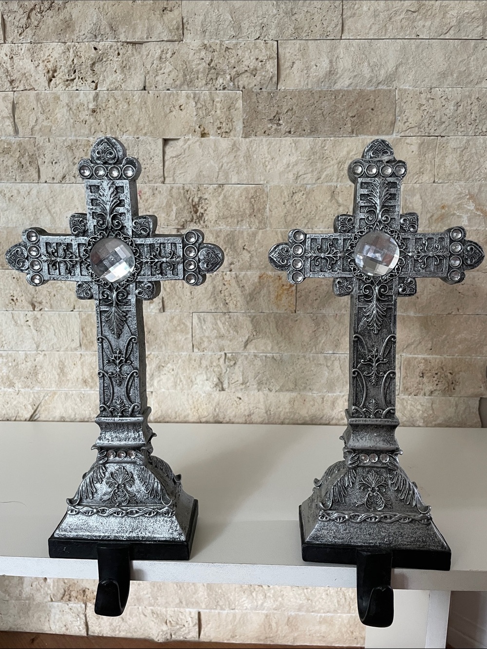 Silver mantle crosses with black hanger (set of 2).